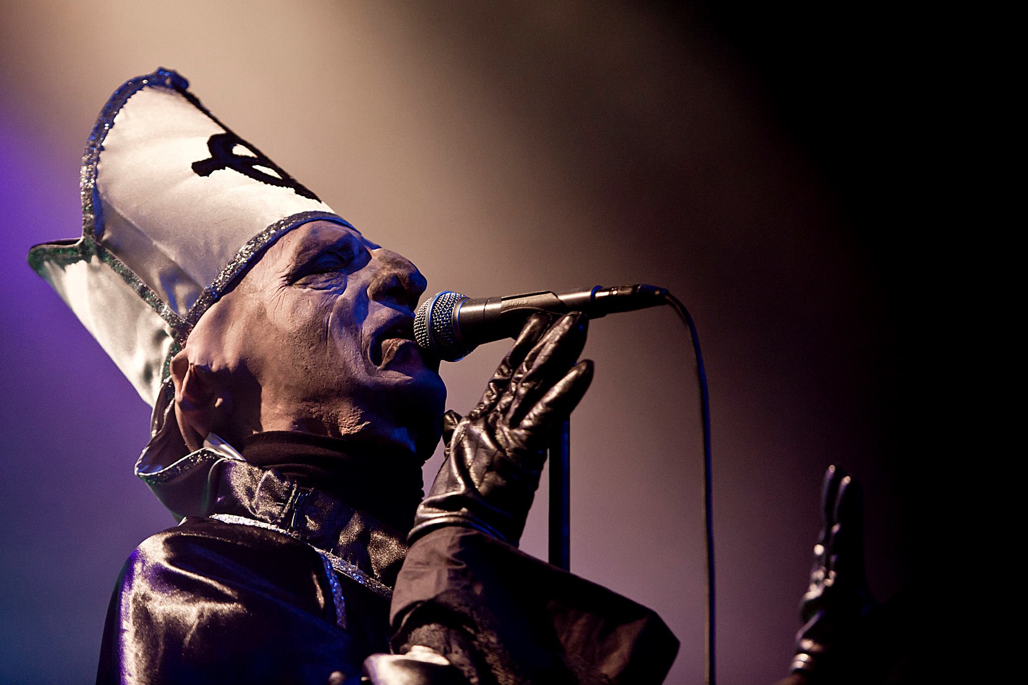 Papa Emeritus sings into microphone