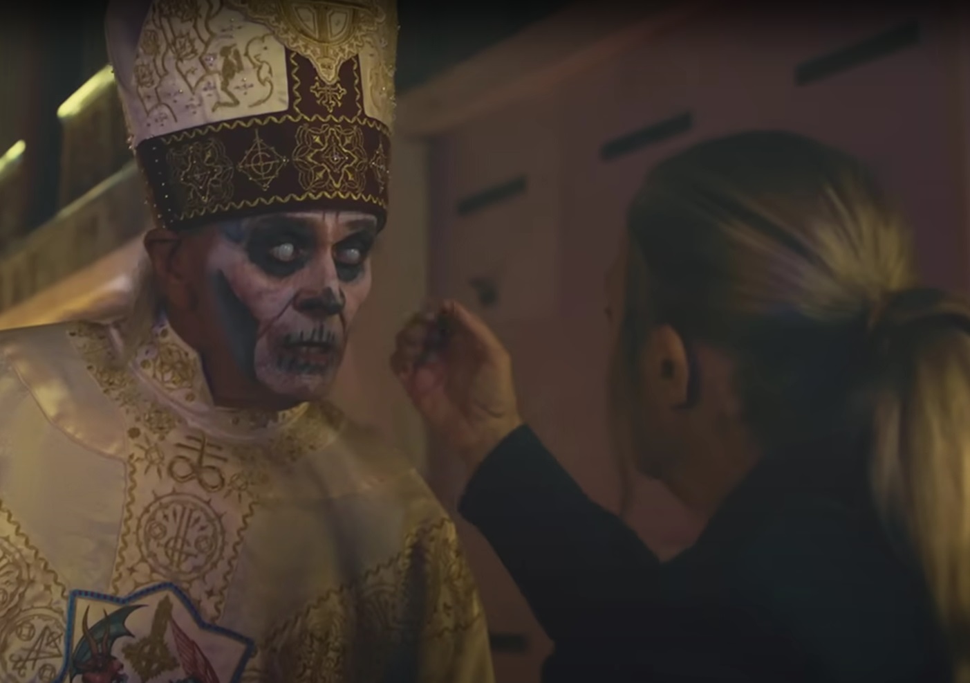 Sister Caresses Papa Nihil's face